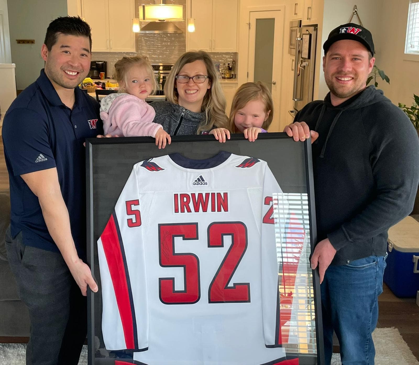A Biggest Assist Award recipient with their signed, framed jersey